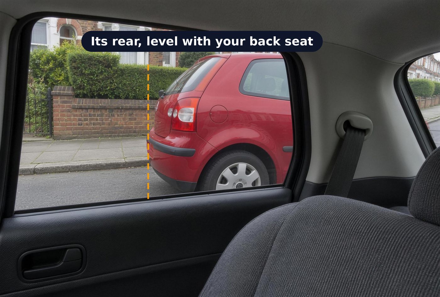Looking out of the left rear passenger window at a parked red car about a metre away. A dashed line marks the back of the red car, seen through the window beside the back seat.